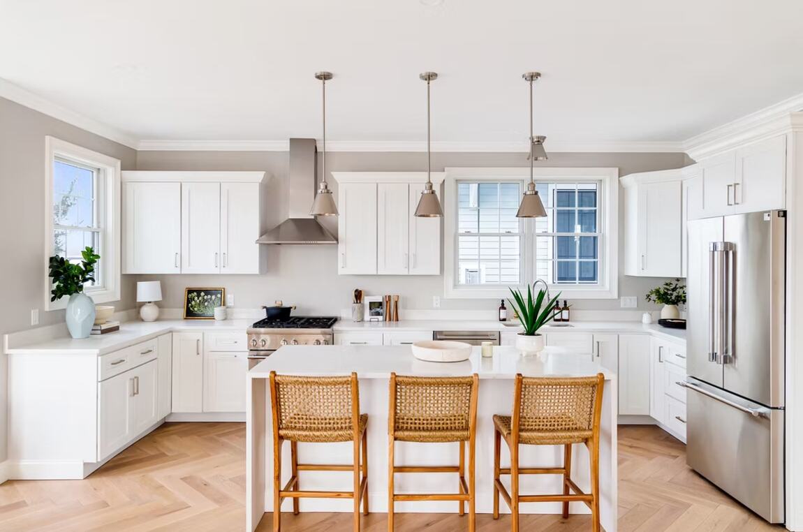 White shaker cabinetry, quartz, island seating